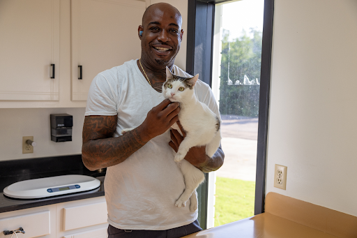 David Lowe with office cat–Peggy