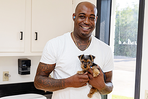 David Lowe with office cat–Peggy